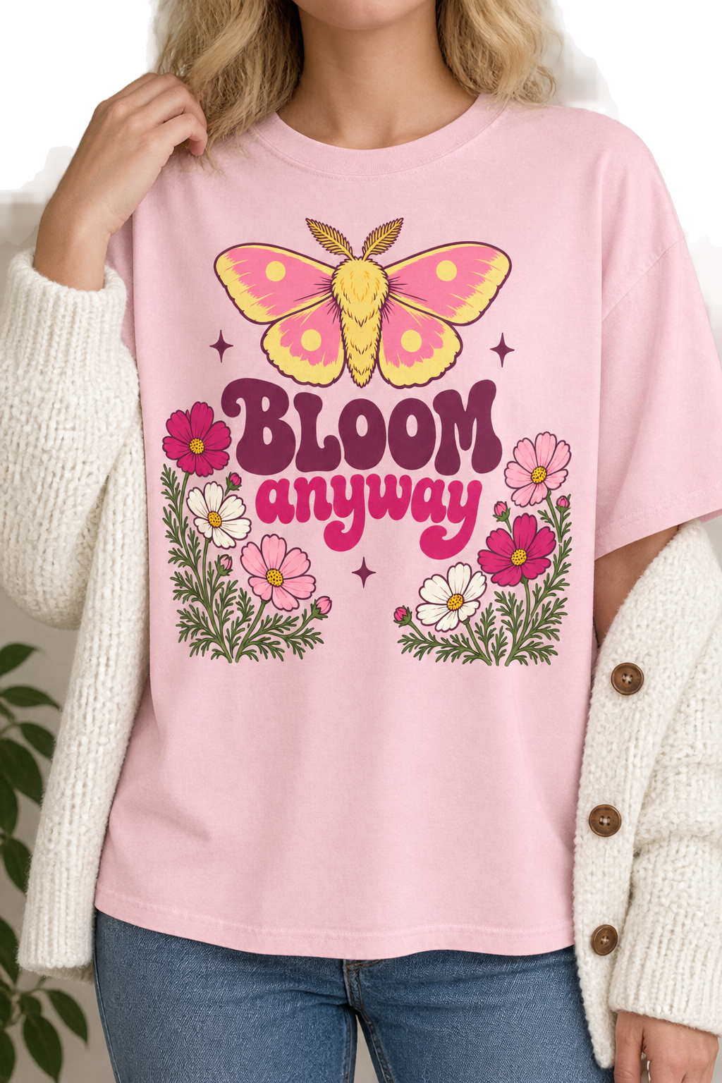 Woman wearing the Bloom Anyway moth tee in light pink