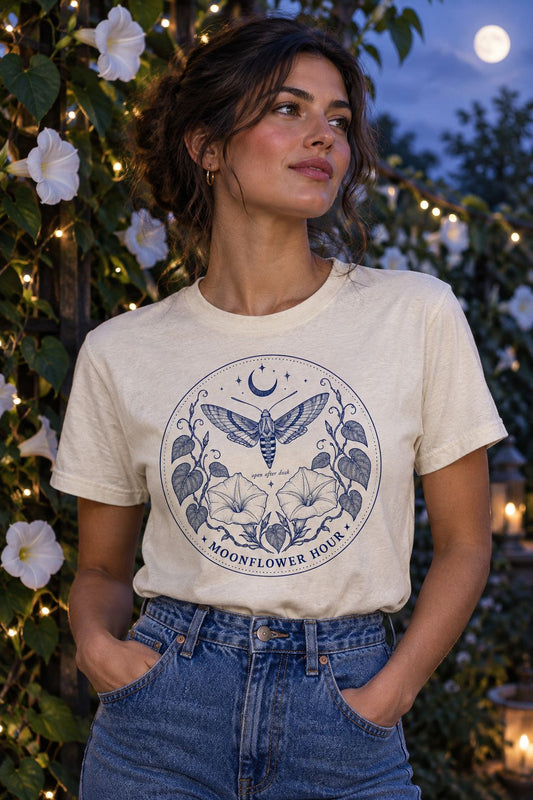 Woman wearing the Moonflower Hour moth tee in Natural in a moonlit garden
